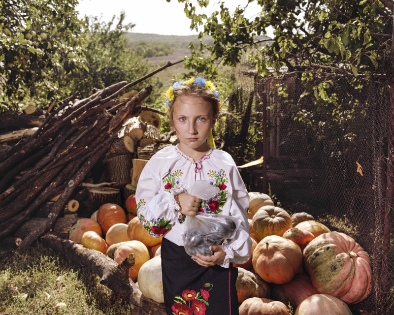 Lina in a national costume, Orihovo-Vasylivka village, Donetsk, 2018. The village of Orihovo-Vasylivka lies mid-way between the city of Kramatorsk and the front line with the separatist-held areas of Donetsk and Luhansk. The re-enforcement of Ukrainian cultural identity through symbols such as national dress, dances, songs and the use of the Ukrainian language seemed to promote a feeling of security among many of the displaced people in Ukraine.